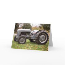 Old tractor in fall greeting cards