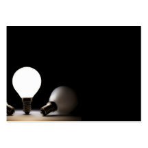 One light bulb shining in a dark space business card template