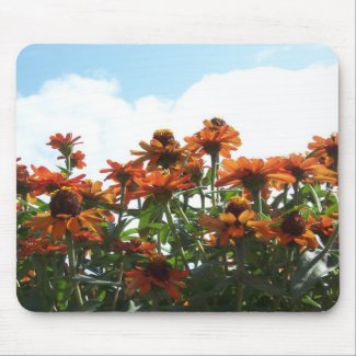 Orange Flowers Against a Blue Sky mousepad