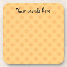 Orange snowflakes on orange background coaster