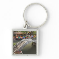 Outdoor cafe along River Walk and bridge over 2 Key Chain
