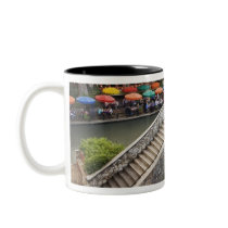 Outdoor cafe along River Walk and bridge over 2 Mug