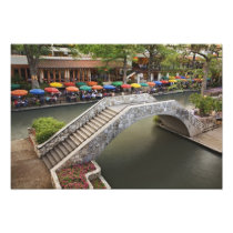 Outdoor cafe along River Walk and bridge over 2