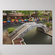 Outdoor cafe along River Walk and bridge over 2