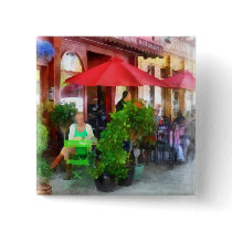 Outdoor Cafe With Red Umbrellas buttons