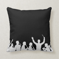 Outline of conductor and band white on black pillows