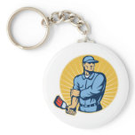 Painter holding paintbrush rolling up sleeves key chains