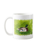Painting of Mallard Duck sitting in the grass mug mugs