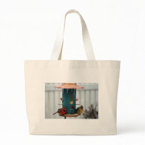 Pair of Cardinals at Icy BirdFeeder Tote Bags