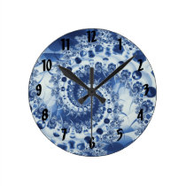 Pale Blue Spiral Shell Fractal Round Clocks