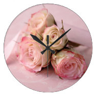 pale roses on pink swirls clock