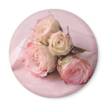 pale roses on pink swirls magnet