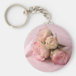pale roses on pink swirls round keychain