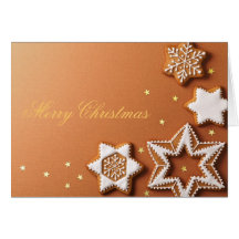 Panes de jengibre del navidad con las estrellas de felicitaciones