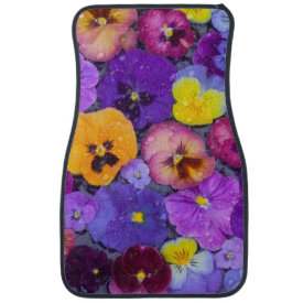 Pansy flowers floating in bird bath with dew floor mat