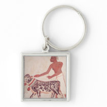 Peasant leading a cow to sacrifice key chains