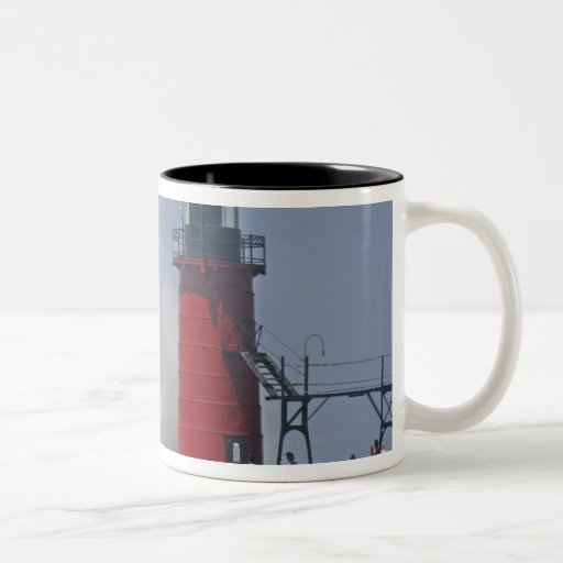 People on jetty watch large breaking waves in 2 mugs
