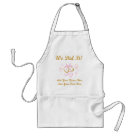 standard_apron - A customizable  wedding apron the newlyweds will love features wedding rings and pink ribbon design and gold text that reads "We Did It!". You can easily add the bride and groom's name to this personalized apron before ordering. It makes a lovely wedding gift!