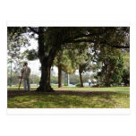 Photo of a man painting in the park post cards