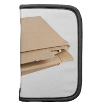 Pile of corrugated cardboard folio planners