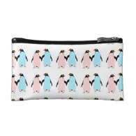 Pink and blue Penguins holding hands. Cosmetics Bags