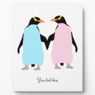 Pink and blue penguins holding hands. display plaques
