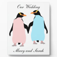 Pink and blue Penguins holding hands Display Plaques