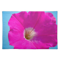 pink petunia flower in blue background. place mats