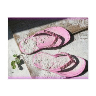 Pink sandy flip flop sandals on Florida beach postcard