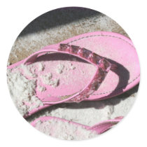 Pink sandy flip flop sandals on Florida beach Round Sticker