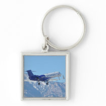 Plane taking off at the airport keychain