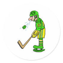 Player spitting out puck round sticker
