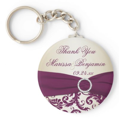This plum and champagne damask wedding favor keychain has a faux ribbon and