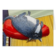 Plump tuxedo cat upside down on cushion greeting card