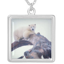 Polar bear on top of a bowhead whale jaw bone, custom necklace