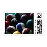 Pool balls on billiard table postage stamps