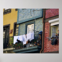 Portugal, Oporto (Porto). Woman hanging laundry Posters