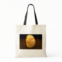 Potato on dirt bag