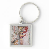 Preparing a mummy for a purification ceremony key chain