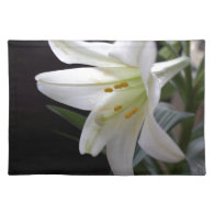 Pretty, pure white Easter lily flower in black Placemat