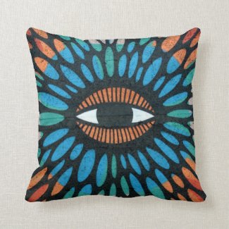 Protective eye graffiti in orange and blue pillows