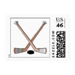 puck and hockey sticks design stamps