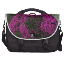 Purple flowers through an arch. laptop bag