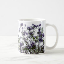 purple green flowers against bright sky floral coffee mug
