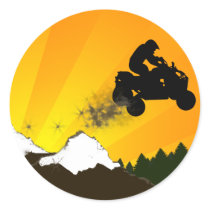 quads. orange sunset. round sticker