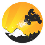 quads. orange sunset. round sticker