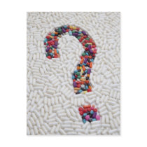 Question mark of pills on white pill background post card