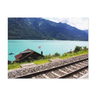 Swiss railway track next to lake