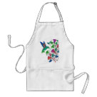  - The simple graphic shapes and the  brilliant colors of the hummingbird  and trumpet shaped flowers blend  together in shades of green, pink,  orange and fuschia. This vibrant colorful artwork is featured on  hummingbird clothing and gifts. Delight your hummingbird  lover today with this beautiful gift.: Sizes  Available colors: white