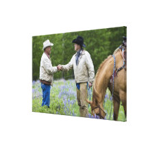 Ranchers shaking hands across the fencing in gallery wrap canvas